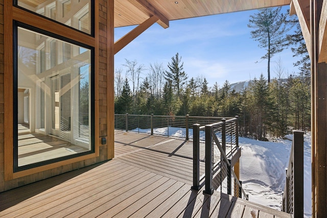 view of snow covered deck