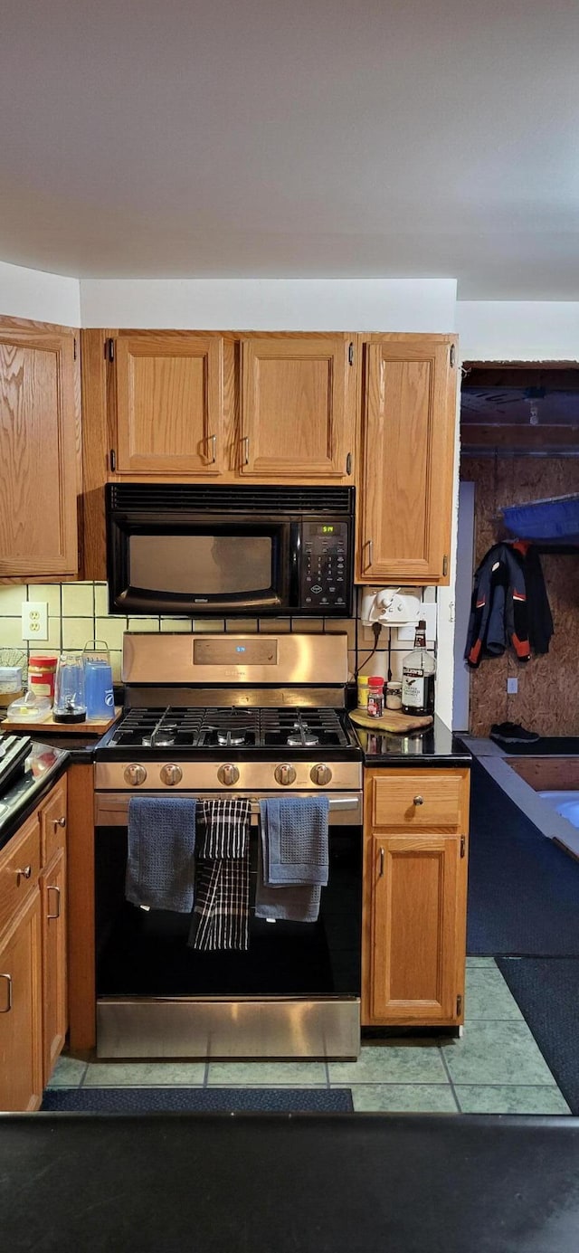 kitchen featuring stainless steel range with gas cooktop and backsplash