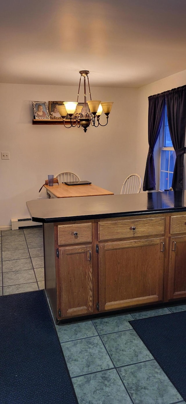 tiled dining room featuring a notable chandelier