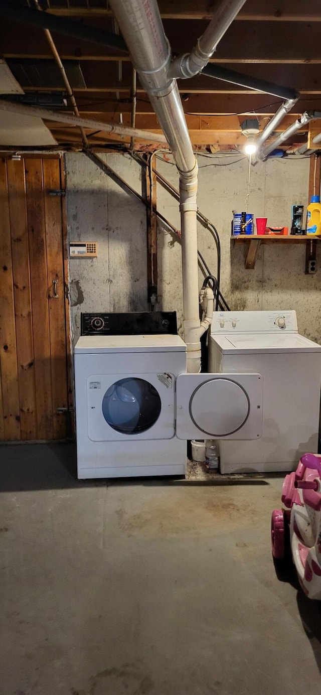 washroom with independent washer and dryer