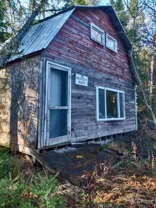 view of home's exterior with an outdoor structure