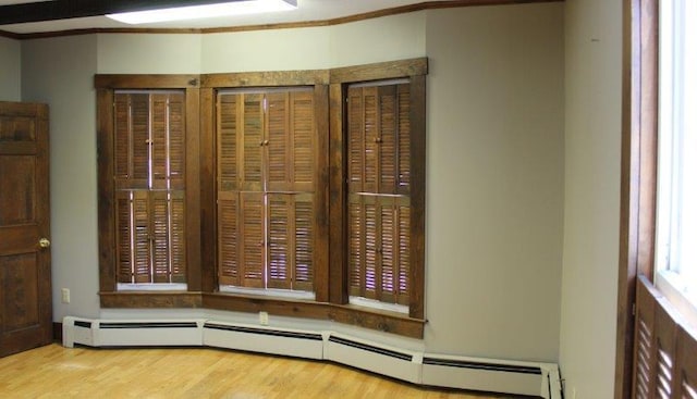 interior details featuring light hardwood / wood-style flooring and baseboard heating