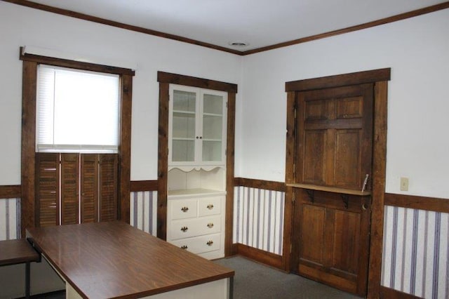 unfurnished office featuring dark carpet