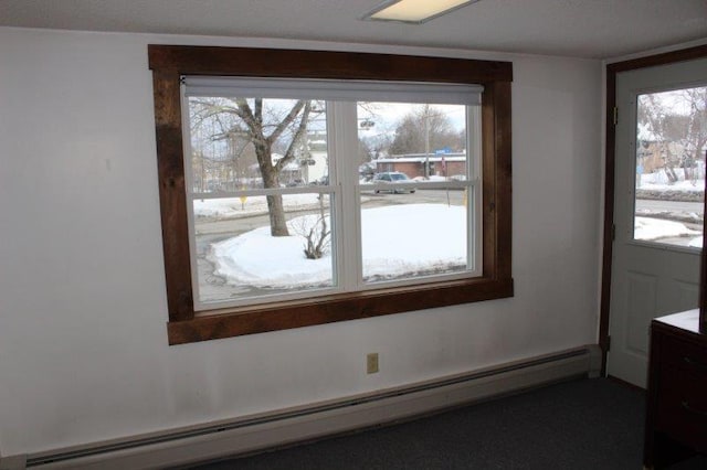 interior space featuring a baseboard heating unit