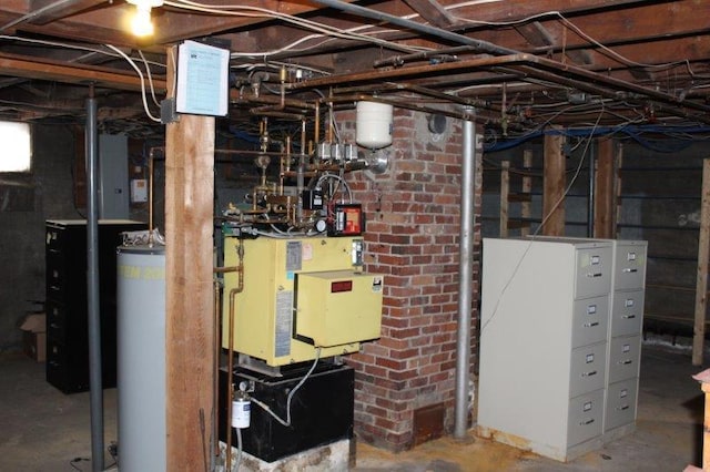 utility room featuring water heater