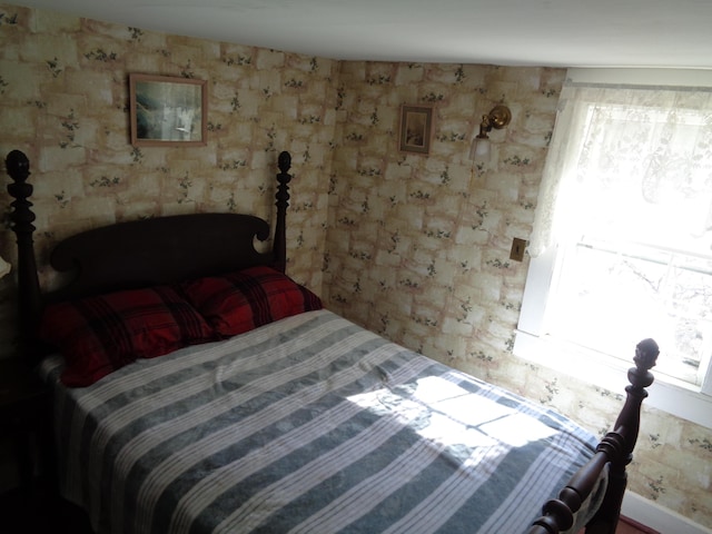 bedroom featuring wallpapered walls