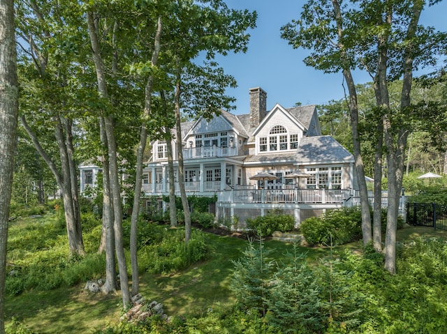 29 Summerhaven Ln, Boothbay, ME 04544 - back of property with a chimney, a wooden deck, and a balcony