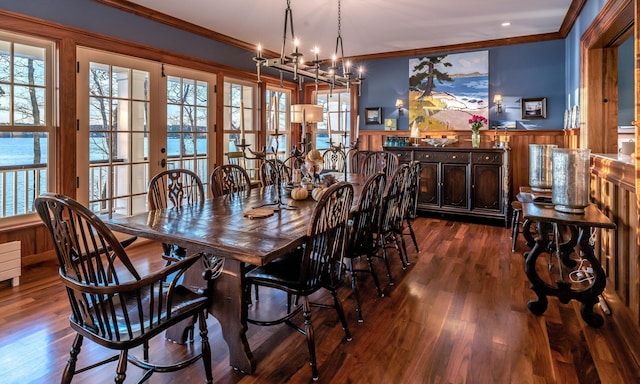 29 Summerhaven Ln, Boothbay, ME 04544 - dining space with crown molding, wainscoting, healthy amount of natural light, a chandelier, and dark wood-style flooring
