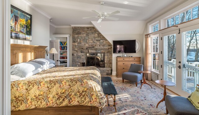 29 Summerhaven Ln, Boothbay, ME 04544 - bedroom featuring access to outside, crown molding, wood finished floors, a stone fireplace, and ceiling fan