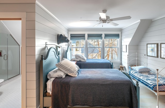 29 Summerhaven Ln, Boothbay, ME 04544 - bedroom with wood finished floors, wooden walls, ornamental molding, and a ceiling fan