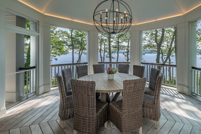 29 Summerhaven Ln, Boothbay, ME 04544 - sunroom with a chandelier, plenty of natural light, hardwood / wood-style flooring, and a deck with water view