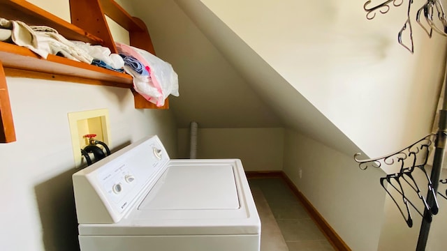 washroom featuring tile flooring and washer / dryer