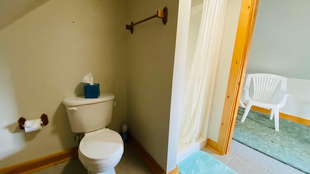 bathroom with toilet and tile flooring