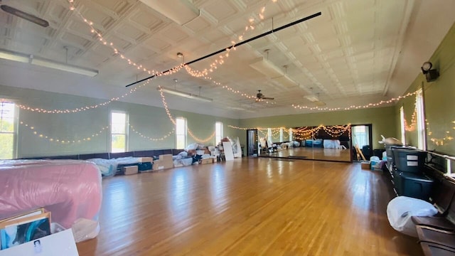 interior space with ceiling fan and hardwood / wood-style floors