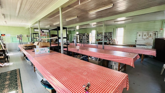 dining space featuring hardwood / wood-style floors and wooden ceiling