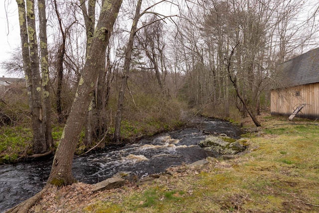 view of yard with a water view