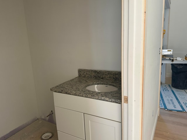 bathroom with vanity and hardwood / wood-style floors