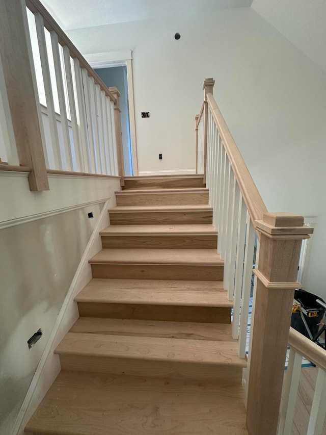 staircase featuring hardwood / wood-style floors