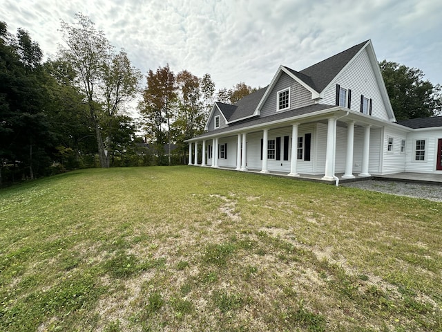 view of side of property with a yard