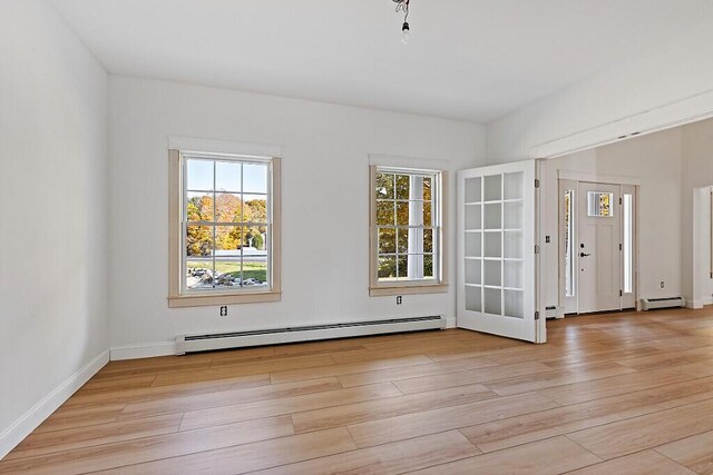 LOT1 Honey Hill Ests W, Hampden, ME 04444 - empty room with a baseboard radiator and light wood-style flooring