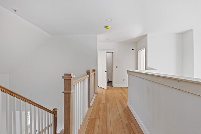 corridor with light hardwood / wood-style floors