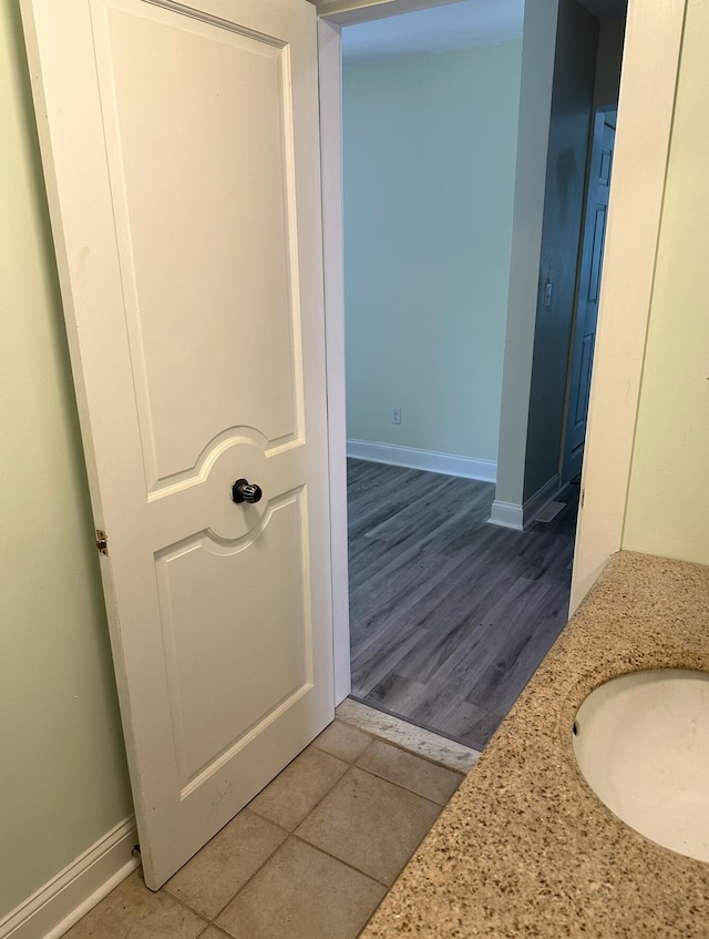 bathroom featuring vanity and hardwood / wood-style floors