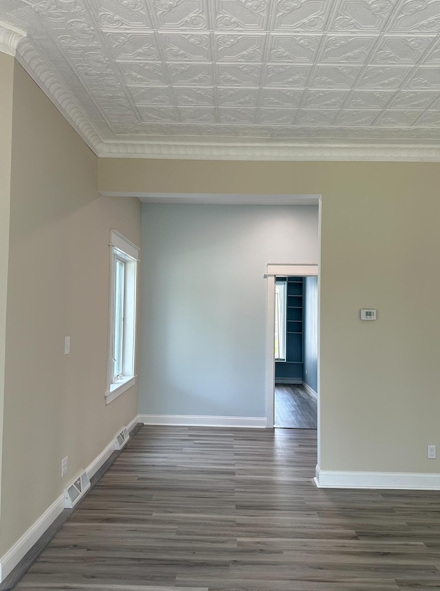 unfurnished room with dark wood-type flooring