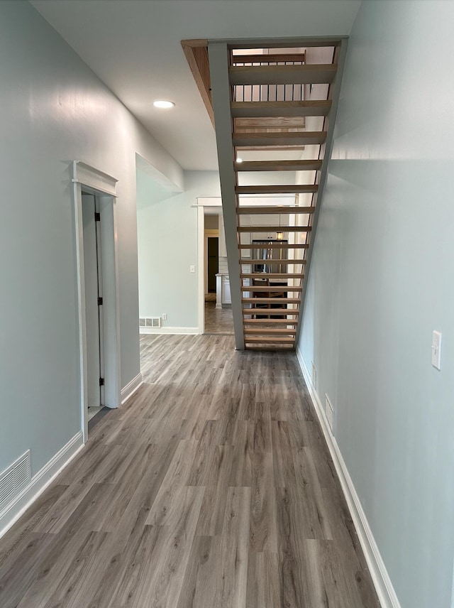 hall with dark hardwood / wood-style flooring