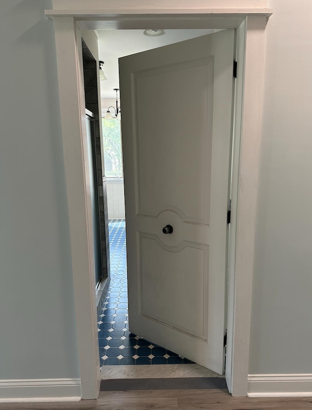 hall with dark hardwood / wood-style floors