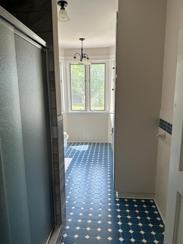 bathroom with toilet and tile floors