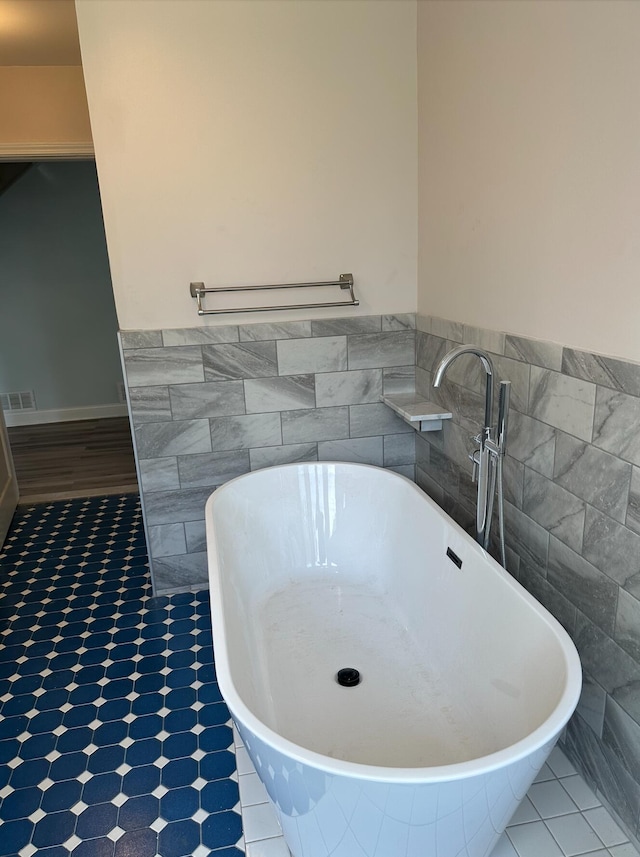 bathroom with tile flooring