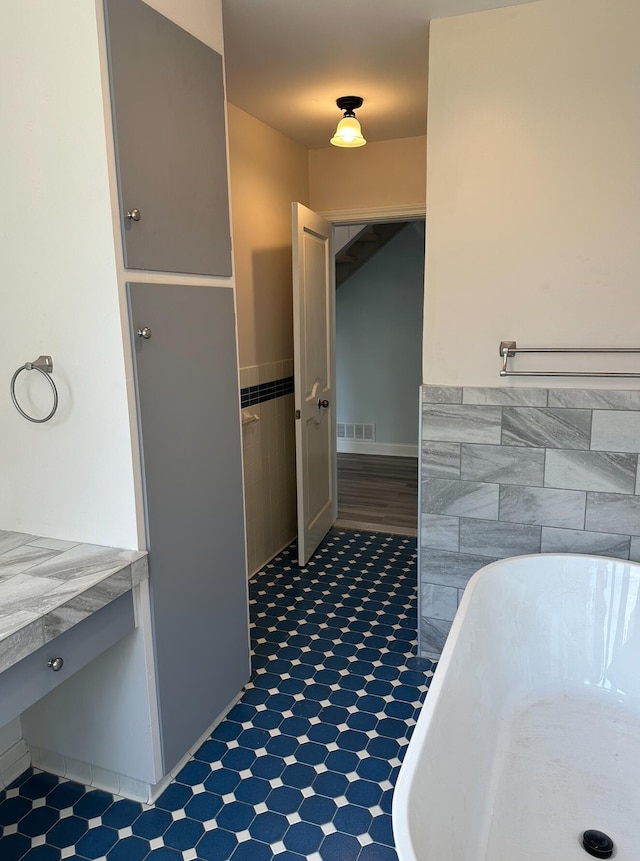 bathroom featuring tile floors