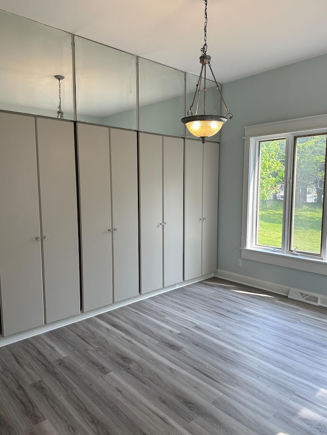 spare room featuring light hardwood / wood-style floors