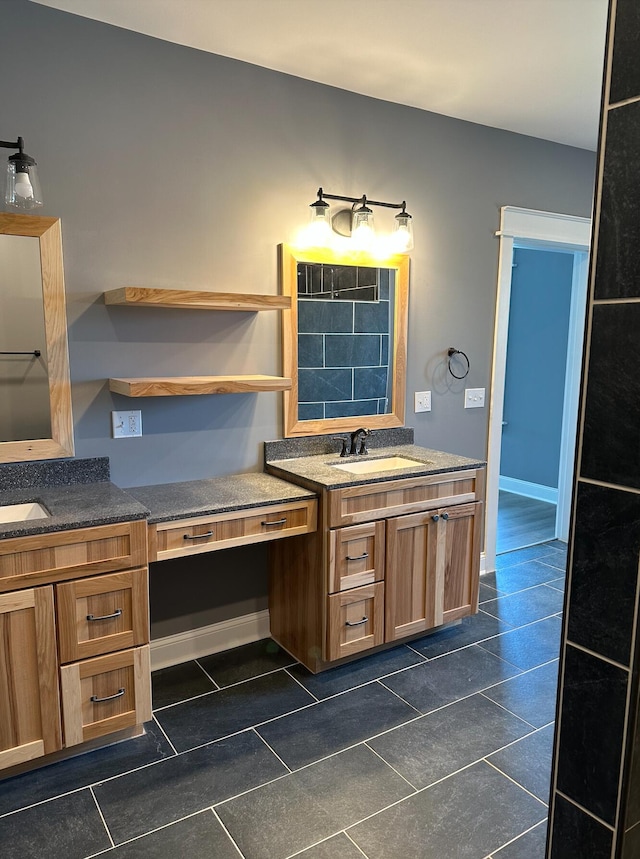 bathroom featuring tile floors, oversized vanity, and dual sinks