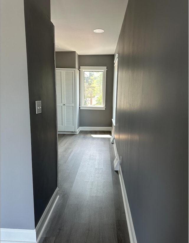 hall with dark hardwood / wood-style floors