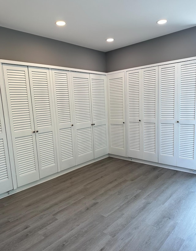 unfurnished bedroom featuring dark wood-type flooring