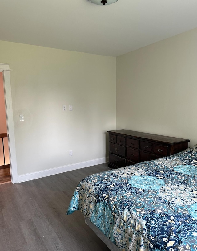 bedroom featuring dark hardwood / wood-style floors