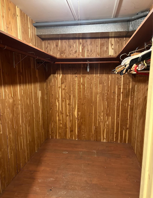 walk in closet featuring hardwood / wood-style flooring