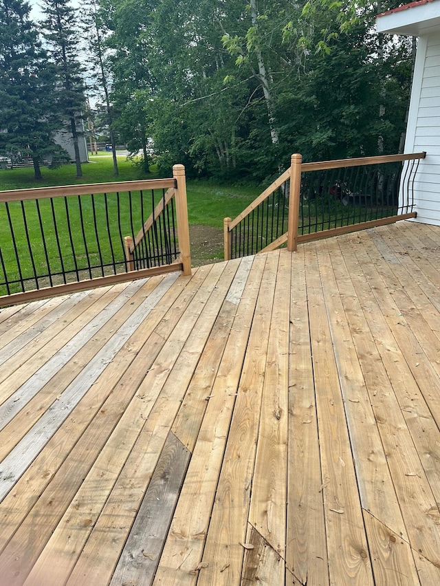 wooden terrace with a yard