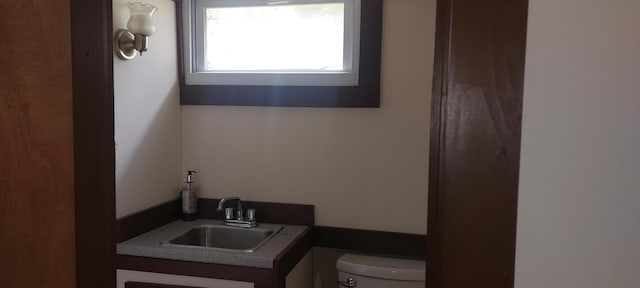 bathroom featuring toilet and vanity