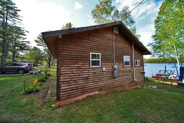 view of home's exterior with a yard