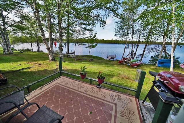 view of patio with a water view