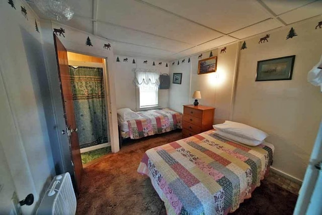 bedroom with dark colored carpet