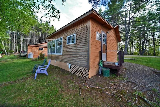 view of property exterior featuring a lawn