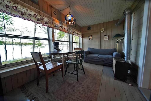 sunroom featuring wood ceiling