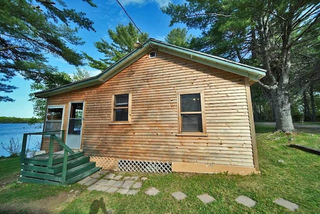 view of property exterior featuring a yard