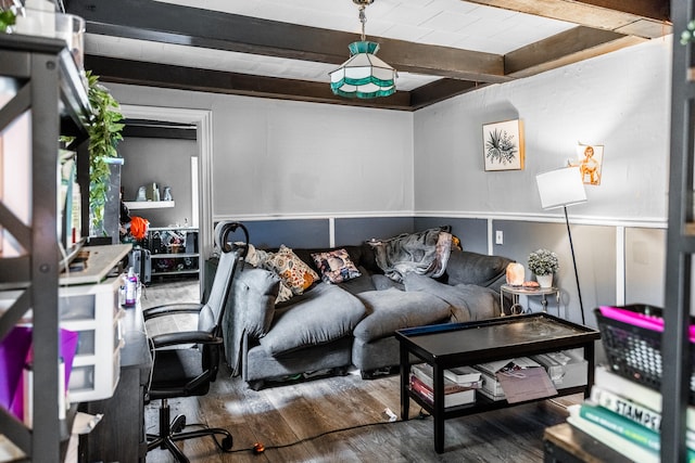 living room with dark wood-type flooring and beam ceiling