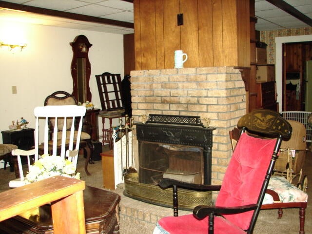 living room with a drop ceiling