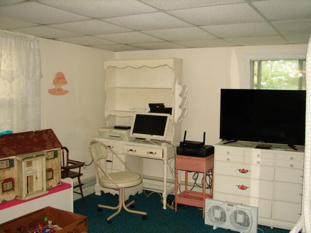 office area with a paneled ceiling