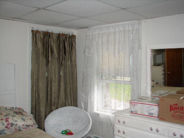 bedroom featuring a drop ceiling